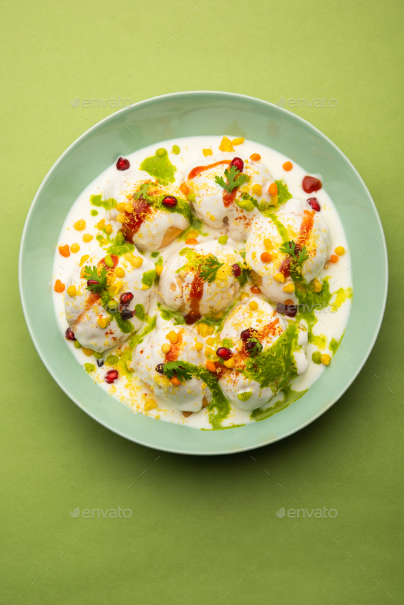 Dahi vada is Indian snack food. Garnished with coriander, boondi
