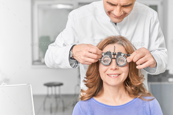 Woman wearing glasses with lens for checking vision