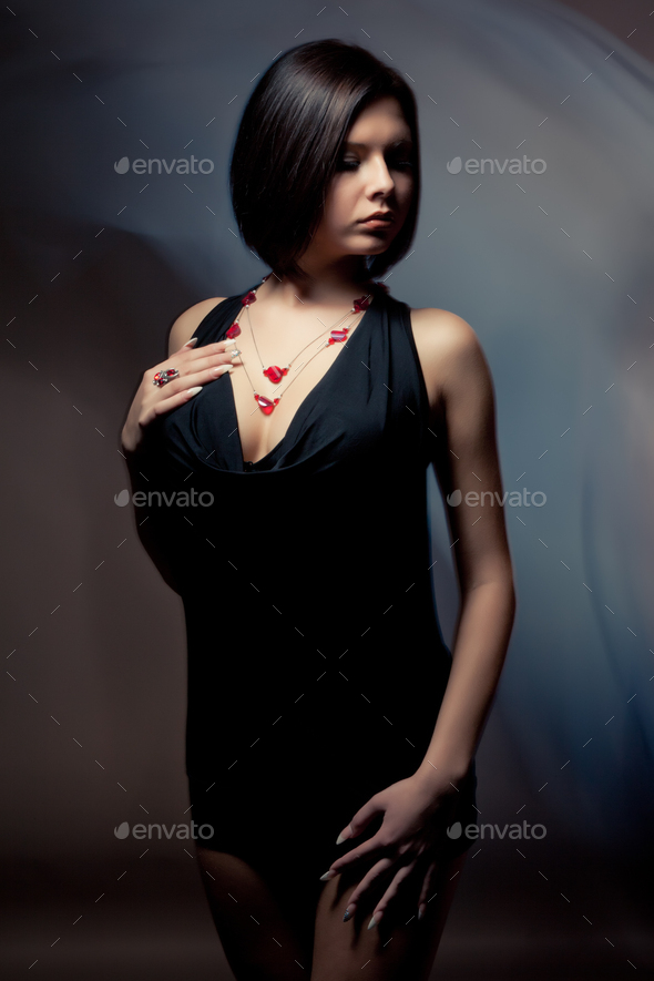 Portrait of the riddler beautiful slender girl Stock Photo by