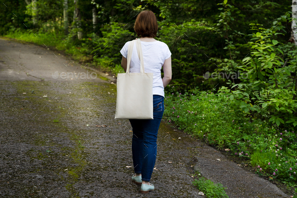 Woman with shop tote bag