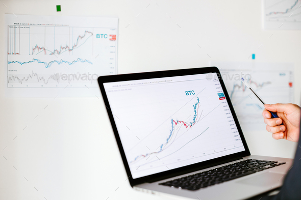 Man trader bitcoin data price trend analysing - Stock Photo - Images