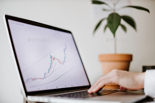 stock trader price trend graph analysing on smartphone - Stock Photo - Images