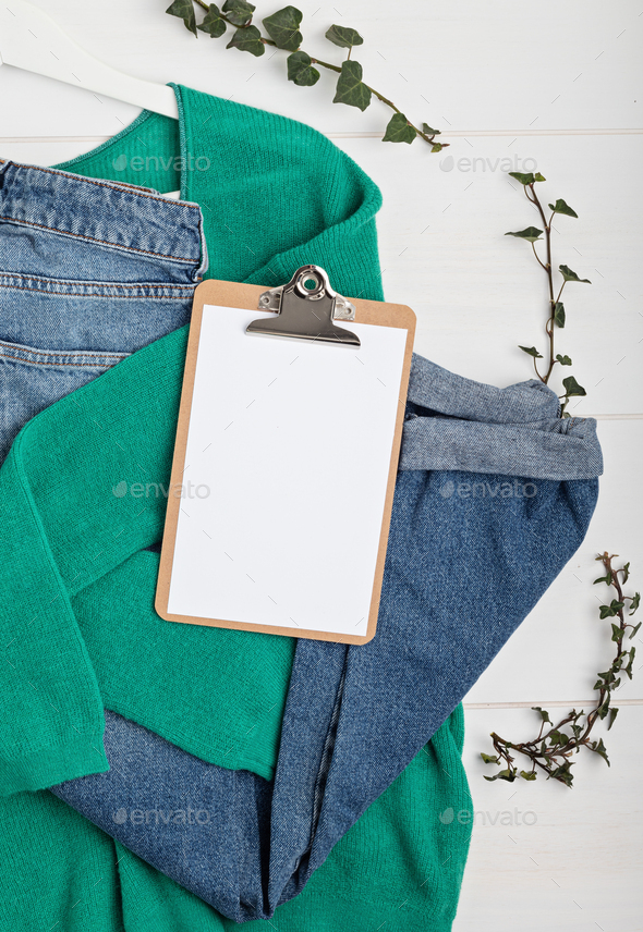 Second hand wardrobe idea. Top view over woman outfit Stock Photo by OksaLy