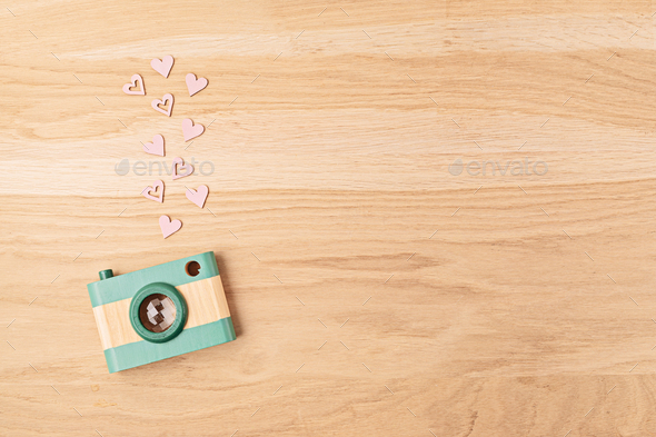 Flat lay with toy wooden camera and hearts. Social media, posts, likes,  followers, online Stock Photo by OksaLy