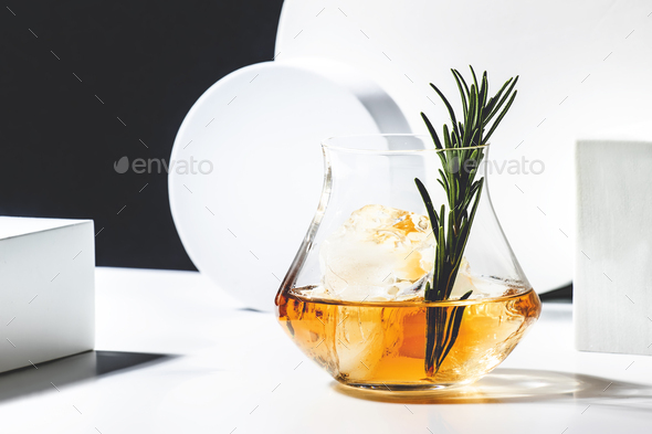 Contemporary still life with whiskey, scotch or bourbon glass