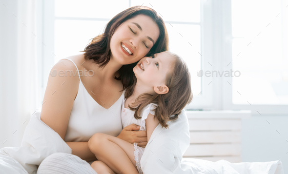 girl and her mother enjoy sunny morning
