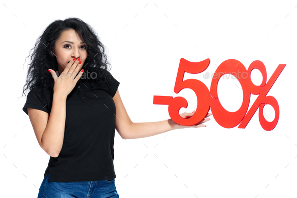 Pretty girl with a sign -50% sale on the white background