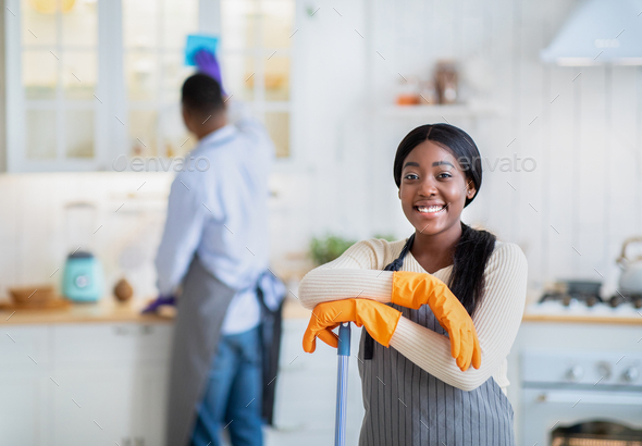 Portrait Of Happy African American Woman With Mop Ready For Cleanup