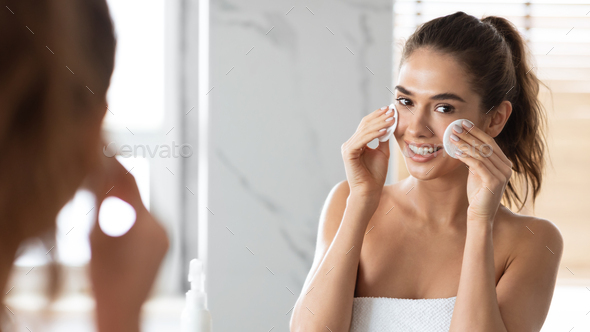 Woman Using Cotton Pads Caring For Skin Under Eyes Indoor