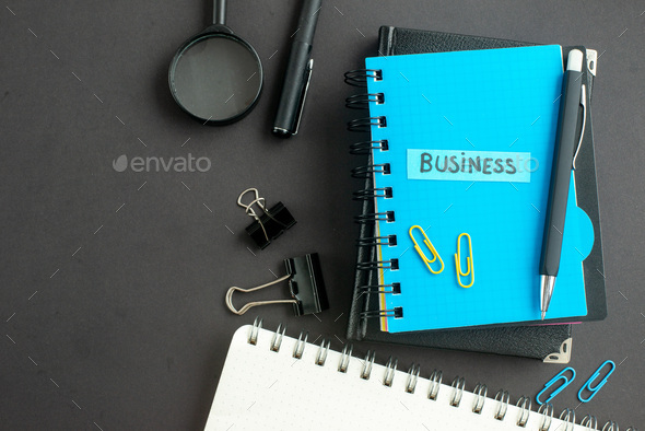 top view business note with notepads and staples on dark background busy school business office
