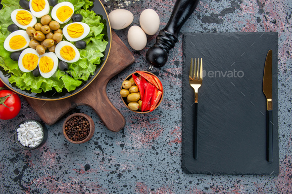 top view tasty boiled eggs with green salad and olives on light background food health meal color