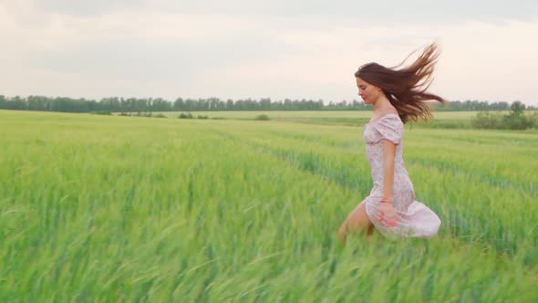 Girl in a White Dress in a Wheat Field at Sunset alt