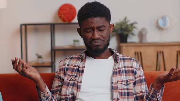 Confused Man Raising Hands in Indignant Expression Asking Why What Reason of Failure at Home alt