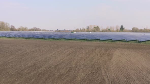 A Solar Farm and Traditional Farming Side By Side alt