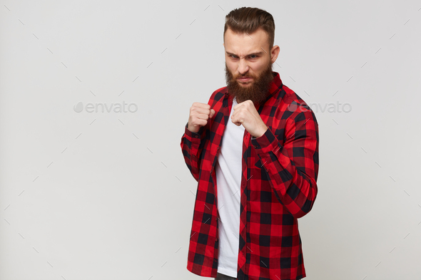 attractive young bearded guy in checkered shirt