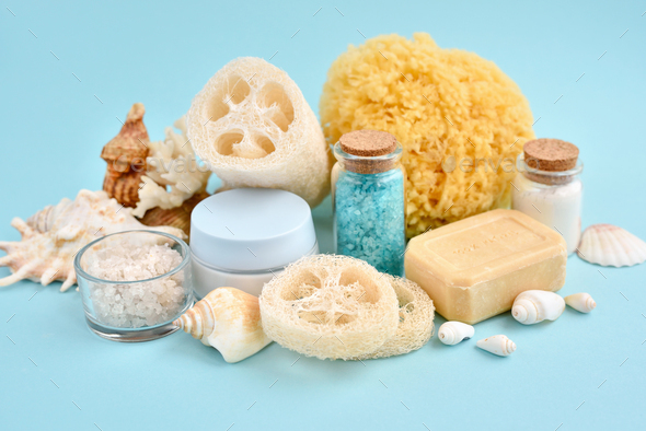 Spa accessories - sea salt, cream, sea sponge, soap and shells in cosmetics set for spa - Stock Photo - Images