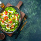 Above view of delicious salad with many fresh ingredients on wooden cutting boa rd spices oil - PhotoDune Item for Sale