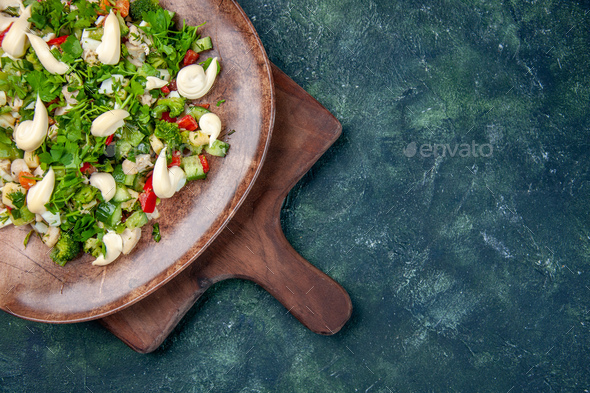 top view tasty vegetable salad inside plate on dark-blue background cuisine health color fit dinner