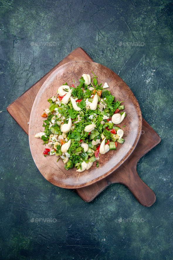top view tasty vegetable salad inside plate on dark-blue background cuisine health color fit
