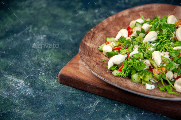 front view vegetable salad inside elegant plate on dark blue background cuisine health color fit