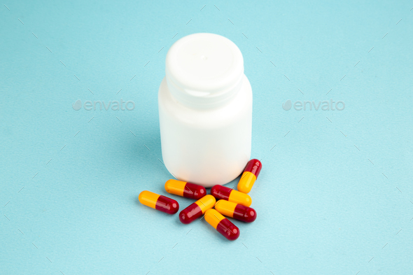 front view little pills can with pills on blue background color virus pandemic hospital health lab