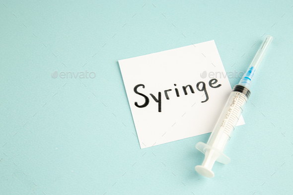 front view antivirus injection with syringe written note on light blue background virus health