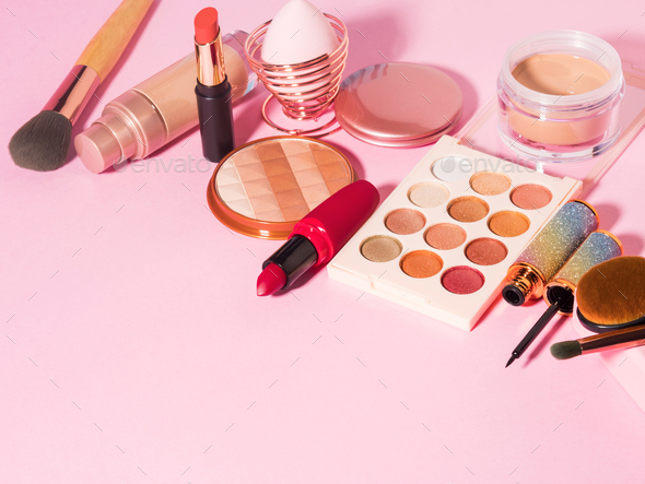 Different make up beauty cosmetics products on pink Stock Photo by tenkende