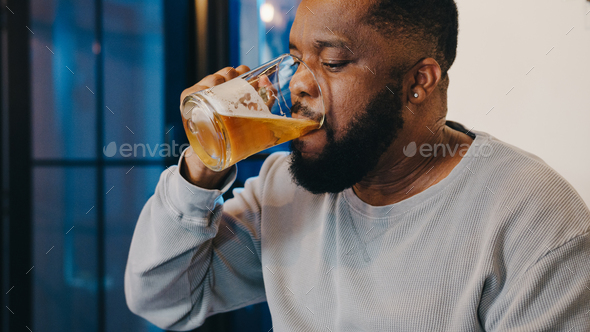 Middle Aged African American Male Drinking Beer Having Fun Happy Night Party Event Online At Home Stock Photo By Tirachard