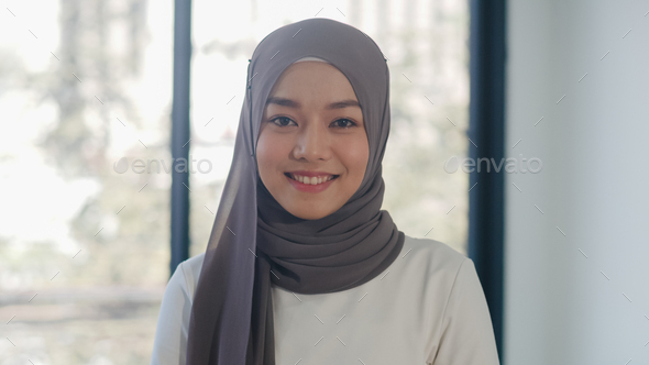 Portrait of successful beautiful executive businesswoman looking at camera and smile in office. - Stock Photo - Images