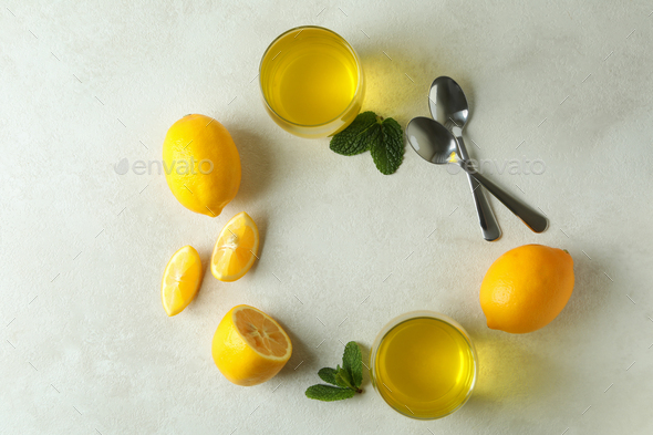 Concept of dessert with lemon jelly on white textured background