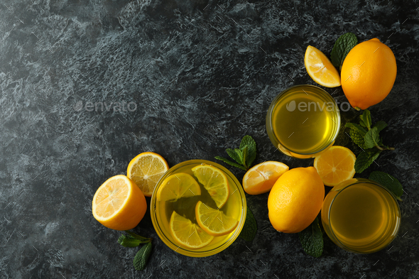 Lemon jelly, lemon slices and mint on black smokey background, top view