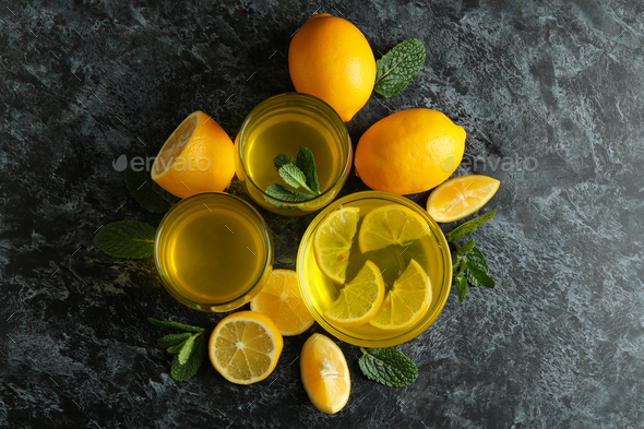 Concept of dessert with lemon jelly with lemon slices on black smokey table