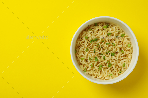 Download Cooked Instant Noodles In Paper Cup On Yellow Background Stock Photo By Atlascomposer