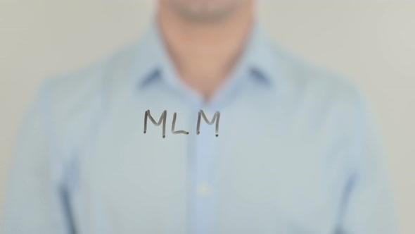 MLM, Man Writing on Transparent Glass Screen alt