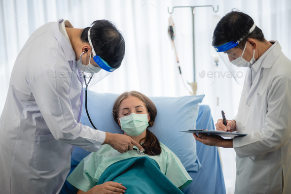 Female patients wear a surgical face mask while being in hospital ...