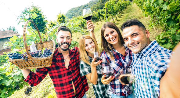 Young friends having fun taking selfie at winery vineyard outdoor