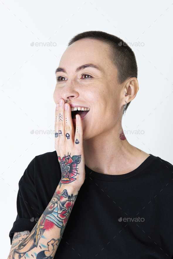 Cool tattooed woman laughing