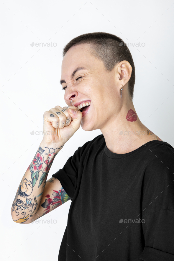 Cool skinhead tattooed woman laughing