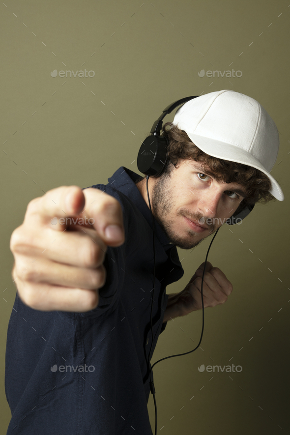 Playful man with headphones Pinterest banner - Stock Photo - Images