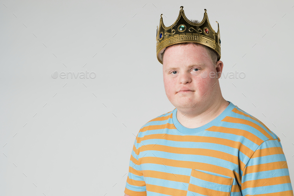 Confident boy with down syndrome wearing a crown Stock Photo by Rawpixel