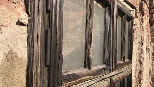 Abandoned house old weathered window details 4K 2160p 30fps UltraHD footage - Wood and glass broken  alt