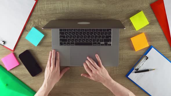 Student is Scrolling Down on the Touchpad of Laptop