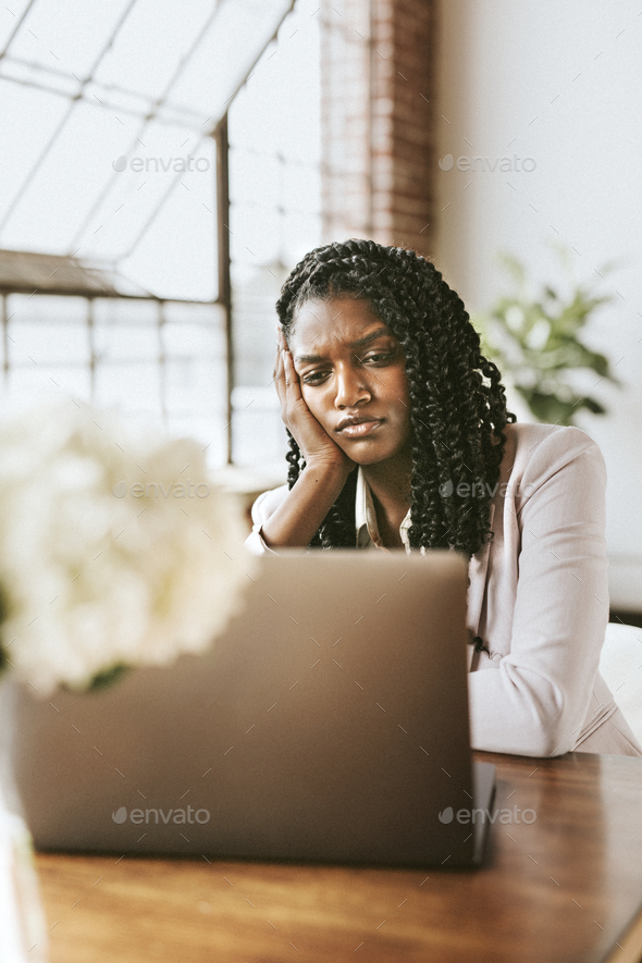 Unhappy businesswoman working - Stock Photo - Images