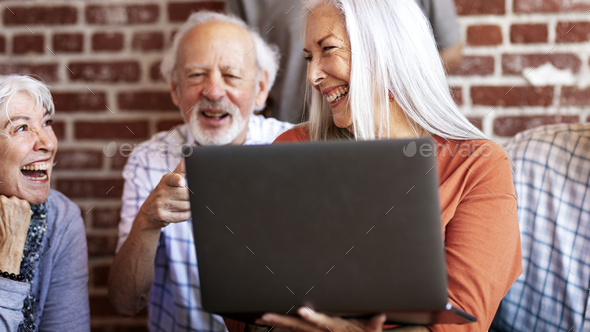 Seniors using a laptop - Stock Photo - Images