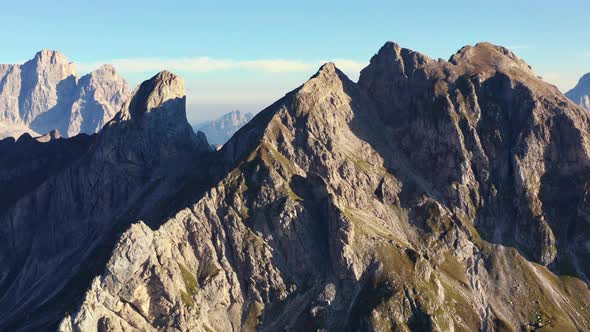 Drone Shot of Giau Pass Mountain Range in Dolomites Italy Against the Blue Sky alt