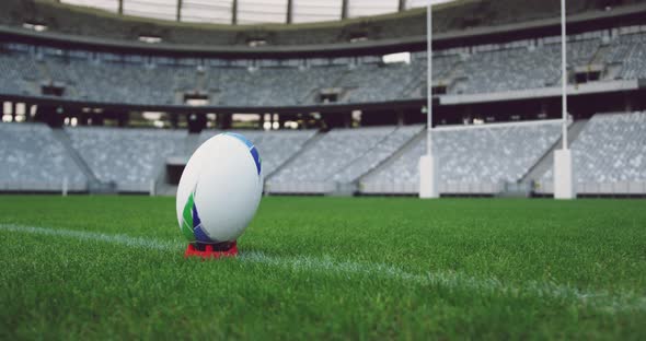 Rugby ball on a grass in the stadium alt