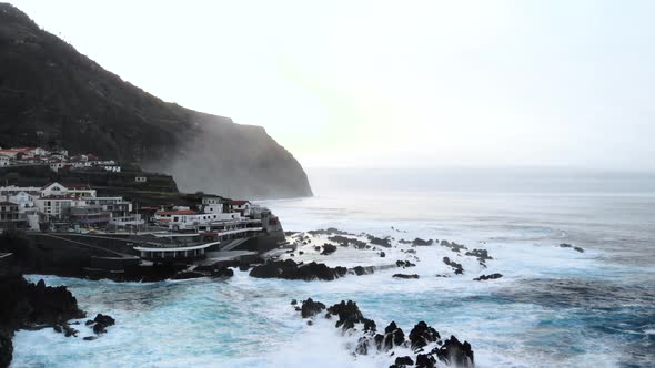 Drone Circle Around Natural Volcanic Swimming at Porto Moniz, Madeira island, Portugal alt