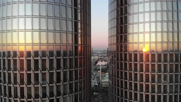 Sunset reflecting from twin luxury high rise glass apartment buildings in Riga, Latvia alt