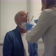 Elderly Man Giving Tests Saliva in Clinic Close Up - VideoHive Item for Sale