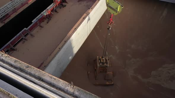 Slow Motion Bulker Storage Filled with Grain alt